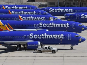 In this file photo taken on March 28, 2019 Southwest Airlines Boeing 737 MAX aircraft are parked on the tarmac after being grounded, at the Southern California Logistics Airport in Victorville, Calif.