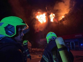 rescuers put out a fire in a supermarket