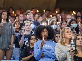 University of North Carolina-Chapel Hill students, faculty and family hold a candlelight vigil