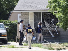 FILE - Law enforcement investigate the scene of a shooting involving the FBI on Aug. 9, 2023, in Provo, Utah. The Utah man accused of making violent threats against President Joe Biden before a western states trip last week pointed a handgun at FBI agents attempting to arrest him, the agency said on Monday, Aug. 14, 2023.