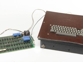 This photo provided by RR Auction shows a vintage Apple computer built in the 1970s and signed by company co-founder Steve Wozniak. The computer sold at auction for more than $223,000. The Apple-1 has been restored to a fully operational state and came with a custom-built case with a built-in keyboard, according to RR Auction, which held the auction that closed on Thursday, Aug. 24, 2023.