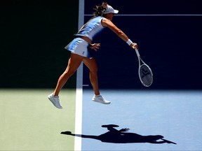 Iga Swiatek of Poland serves during her match against Kaja Juvan of Slovenia at the 2023 US Open.