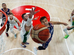 Serbia's Bogdan Bogdanovic (right) drives to the basket under pressure from Lithuania's Jonas Valanciunas during the FIBA Basketball World Cup quarter-finals.