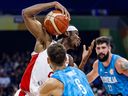 Shai Gilgeous-Alexander of Canada drives to the basket against Aleksej Nikolic of Slovenia during the FIBA Basketball World Cup.