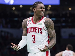 Houston Rockets guard Kevin Porter Jr. reacts during an NBA basketball game against the Charlotte Hornets.