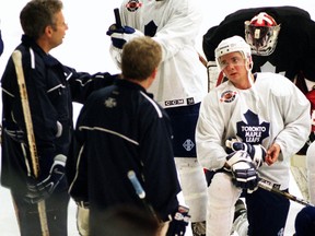 Leafs scout Garth Malarchuk (left) and Leafs development coach Paul Dennis talking with Carlo Colaiacovo in 2001.