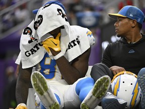 Mike Williams of the Los Angeles Chargers is carted off the field during the fourth quarter against the Minnesota Vikings.