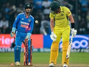 Australia's Sean Abbott (R) is clean bowled by India's Ravindra Jadeja during the second one-day international (ODI) cricket match on Sept. 24, 2023.