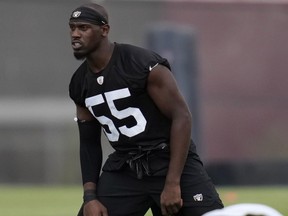 Las Vegas Raiders defensive end Chandler Jones warms up during an NFL football practice at the team's training facility.
