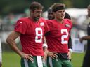 New York Jets quarterbacks Aaron Rodgers, left, and Zach Wilson warm-up during a practice.