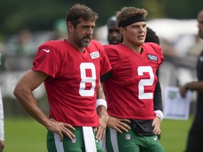 New York Jets quarterbacks Aaron Rodgers, left, and Zach Wilson warm-up during a practice.