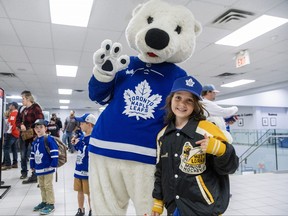 Toronto Maple Leafs mascot Carlton poses for a photo with eight-year-old Taylor Brokenshire.