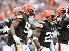 Myles Garrett (centre) of the Cleveland Browns celebrates with teammates after sacking Ryan Tannehill of the Tennessee Titans last week.