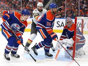 Ryan Nugent-Hopkins #93, left, Darnell Nurse #25, and Jack Campbell #36 of the Edmonton Oilers defend the net in the third period against the Las Vegas Golden Knights in Game Six of the Second Round of the 2023 Stanley Cup Playoffs on May 14, 2023, at Rogers Place in Edmonton.