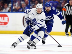 Maple Leafs defenceman Jake McCabe (left) and Nicholas Paul of the Tampa Bay Lightning fight for the puck during Game 4 of the first round of the 2023 Stanley Cup playoffs at Amalie Arena on April 24, 2023 in Tampa.