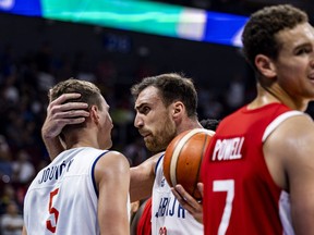 Nikola Milutinov #33 and Nikola Jovic #5 of Serbia celebrate after scoring during the FIBA Basketball World Cup Semi Final game between Serbia and Canada at Mall of Asia Arena on September 08, 2023 in Manila, Philippines. (Photo by Ezra Acayan/Getty Images)