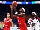 Shai Gilgeous-Alexander #2 of Canada drives to the basket against Bobby Portis #9 in the second quarter during the FIBA ​​Basketball World Cup 3rd place game at the Mall of Asia Arena on September 10, 2023 in Manila, Philippines from the United States.