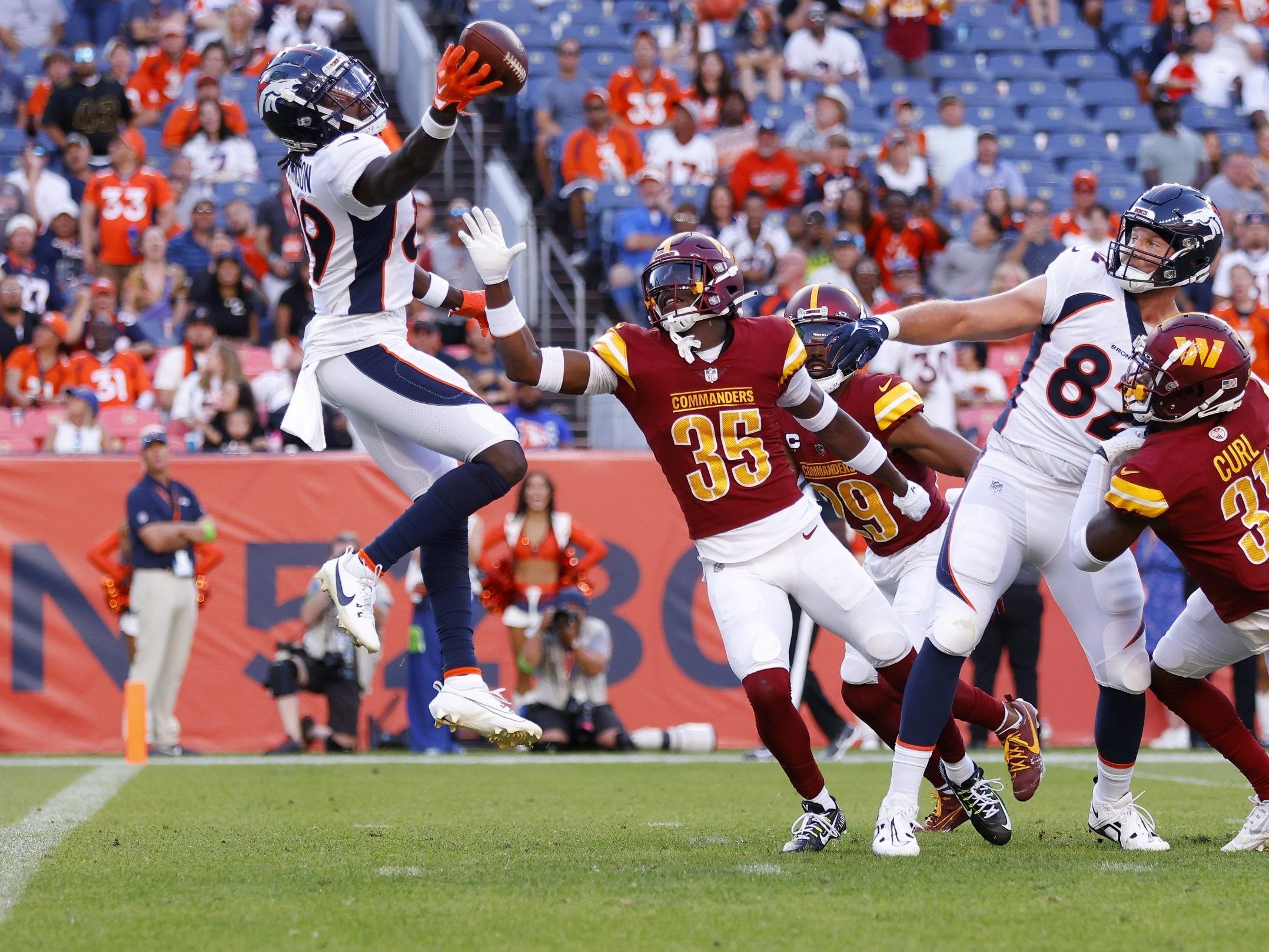 The Washington Commanders trail the Denver Broncos 21-14 at