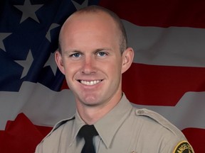 This undated photo provided by Los Angeles County Sheriff’s Department shows its Deputy Ryan Clinkunbroomer.