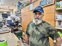 Montrealer Sukhwinder Dhillon says he was planning to visit his birthplace in India's Punjab state to see family and sort out affairs with his deceased father's estate, but has now put the trip on hold. Dhillon is seen in his shop in Montreal, Thursday, Sept. 21, 2023. 