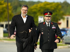 Lt.-Gen. Steven Whelan, right, and his lawyer Phillip Millar arrive at a court martial in Gatineau, Que., on Monday, Sept. 25, 2023.