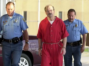 Dennis Rader is escorted into the El Dorado Correctional Facility.