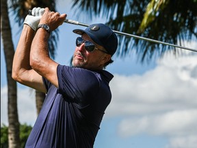 In this file photo taken on Oct. 28, 2022, U.S. golfer Phil Mickelson plays a shot during the first round of the 2022 LIV Golf Invitational Miami at Trump National Doral Miami golf club in Miami.