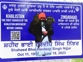 A poster of the former Gurdwara President Hardeep Singh Nijjar is displayed on a fence outside the Guru Nanak Sikh Gurdwara temple in Surrey, British Columbia, Canada, on September 19, 2023. (Photo by DON MACKINNON/AFP via Getty Images)