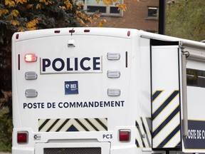 In this file photo taken on Oct. 29, 2020, a Bureau des enquetes independantes (BEI) command post is pictured at the scene of a police shooting in Montreal.