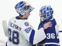 Tampa Bay Lightning goaltender Andrei Vasilevskiy meets with Maple Leafs goaltender Jack Campbell after the Maple Leafs were knocked out of the 2022 Stanley Cup playoffs. Lightning coach Jon Cooper admits to Steve Simmons that the Leafs deserved to win that series, just as his team deserved to win last spring's rematch. 