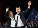Conservative Leader Pierre Poilievre and his wife Anaida wave to delegates at the Conservative Party Convention, Friday, Sept. 8, 2023 in Quebec City. 