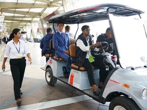 Prime Minister Justin Trudeau drives in a golf cart en route to a final press conference after the G20 summit in New Delhi, India on Sunday, September 10, 2023. THE CANADIAN PRESS/Sean Kilpatrick