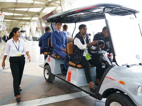 Prime Minister Justin Trudeau rides in a golf cart as he makes his way to a closing press conference following the G20 Summit in New Delhi, India on Sunday, Sept. 10, 2023. THE CANADIAN PRESS/Sean Kilpatrick