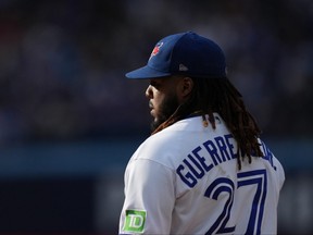 Blue Jays' Vladimir Guerrero Jr. stands on first base during the eighth inning against the Boston Red Sox in Toronto, Saturday, Sept. 16, 2023.
