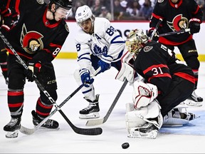 Maple Leafs' William Nylander (88) looks for the puck as Ottawa Senators' Anton Forsberg and Jake Sanderson defend during third-period pre-season action in Ottawa, on Sunday, Sept. 24, 2023.