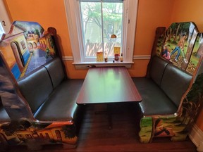 Booths with artwork at El Rincon Mexican restaurant