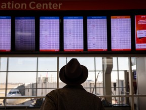 Passengers pass through Dallas-Fort Worth International Airport