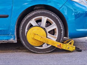 Parked car with an immobilizer tire lock of illegally