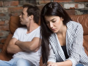 Sad pensive young woman thinking of relationships problems after fight