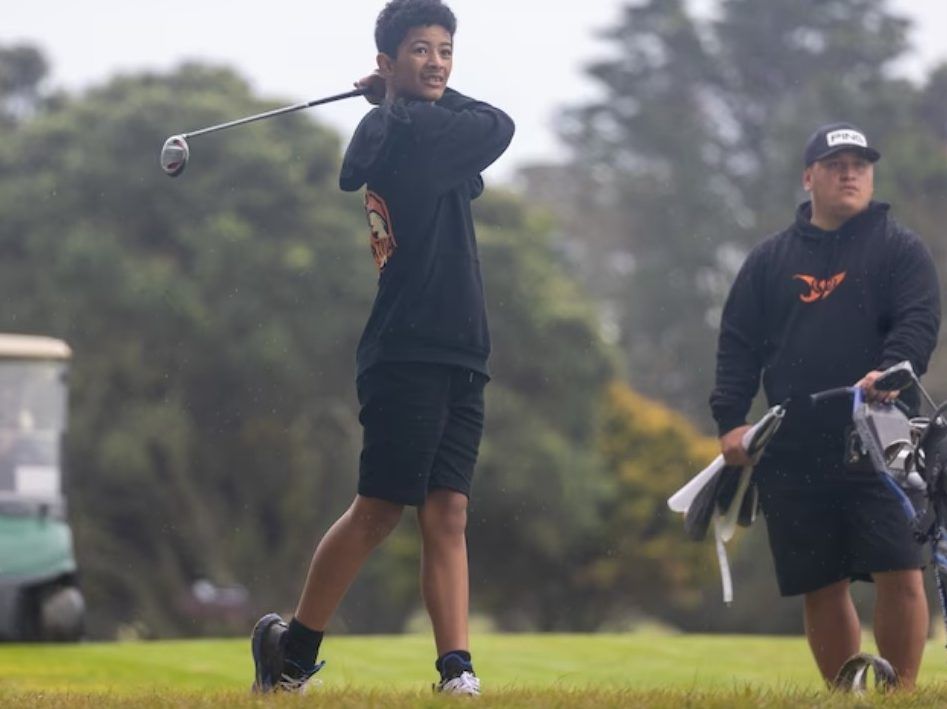 Golfer Bayleigh Teepa-Tarau, from the small New Zealand town of Taneatua, tees off on his way to winning the nine-hole title at the Zespri 2023 Association of Intermediate and Middle Schools (AIMS) Games in Tauranga. 
