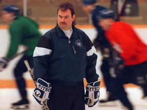 Toronto Maple Leafs coach Pat Burns keeps a close eye on the team during a practice session at Maple Leaf Gardens in Toronto on Jan. 16, 1994.
