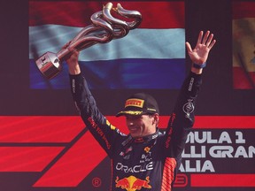 Race winner Max Verstappen of the Netherlands and Oracle Red Bull Racing celebrates on the podium during the F1 Grand Prix of Italy at Autodromo Nazionale Monza on Sept. 3, 2023 in Monza, Italy.