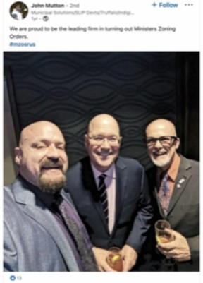 Former Clarington Mayor John Mutton, left, is pictured with Ontario Housing Minister Steve Clark, centre, in a photo shared to Facebook.
