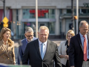 Ontario Premier Doug Ford and other Progressive Conservative Party of Ontario members arrive at press conference in Niagara Falls, Ont., Thursday, Sept. 21, 2023 where he announced that he will be reversing his government’s decision to open the Greenbelt to developers. The announcement comes after a second cabinet minister resigned in the wake of the Greenbelt controversy.