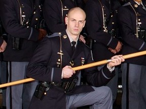 Officer holding flag