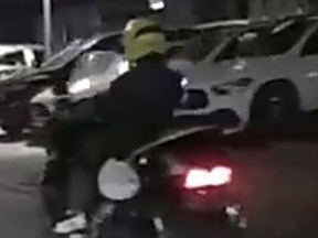 Toronto Police are looking to identify a suspect riding a motorcycle after a cyclist was seriously injured last month.