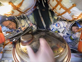 In this handout provided by NASA, Expedition 69 NASA astronaut Frank Rubio (left) and Roscosmos cosmonaut Dmitri Petelin are seen inside the Soyuz MS-23 spacecraft just minutes after they and Roscosmos cosmonaut Sergey Prokopyev, landed in a remote area near the town of Zhezkazgan, Kazakhstan on Sept. 27, 2023.