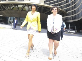 Toronto Mayor Olivia Chow walks outside of City Hall.
