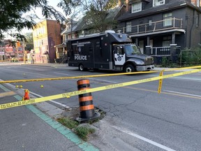 A Toronto Police forensic identification vehicle is seen parked on Sherbourne St. near Dundas St. early Saturday, Sept. 16, 2023, following a shooting that left four people seriously injured.