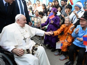 This handout photo taken and released by Vatican Media